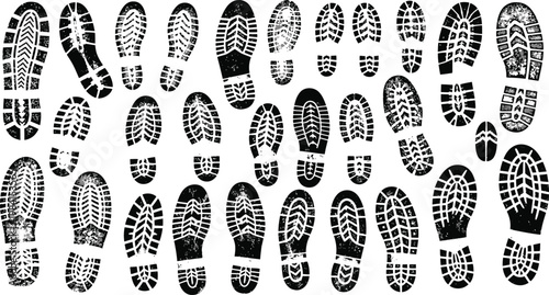 A dense collection of various shoe and boot prints covering a surface creating a textured pattern
