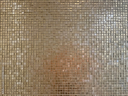 Gold glass mosaic tile wall texture with reflective geometric square pattern