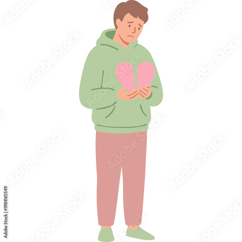 A man holds broken heart pieces in his hands showing sadness.