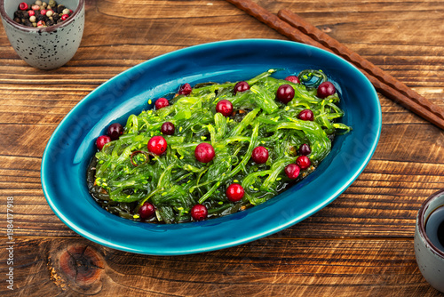 Seaweed salad bowl with cranberries,vegan superfood.
