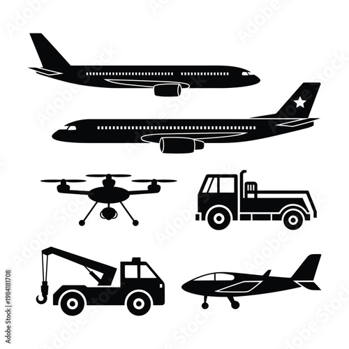 Assorted vehicles including aircraft and ground support equipment in black and white