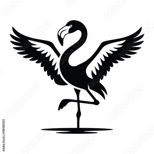 Elegant black silhouette of a flamingo standing gracefully with outspread wings