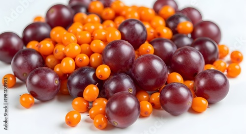 Vibrant Pile of Freshly Harvested Sea Buckthorn Berries and Plums, Close-up Shot.