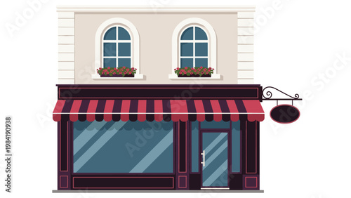 Classic facade of a two-story street shop with a striped awning and arched windows decorated with blooming flowers in window boxes.