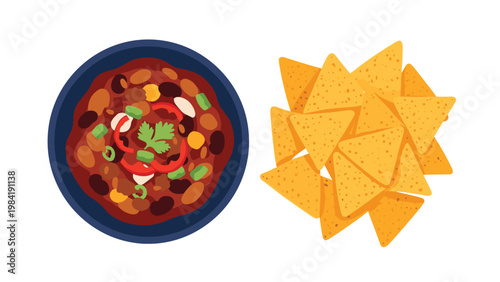 Overhead view of a delicious bowl of hot chili with various toppings served next to a generous pile of crispy corn tortilla chips.
