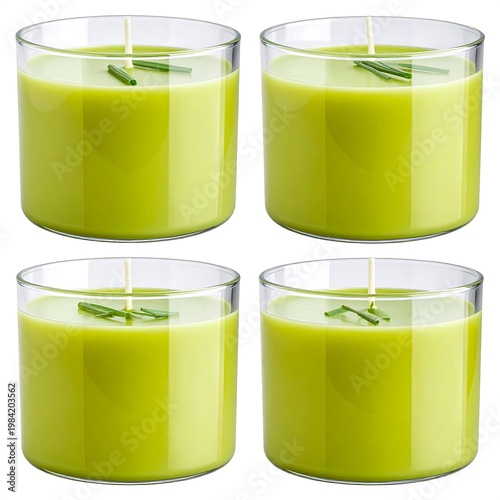 Four green wax candles in clear glass, each with a tiny chive garnish
