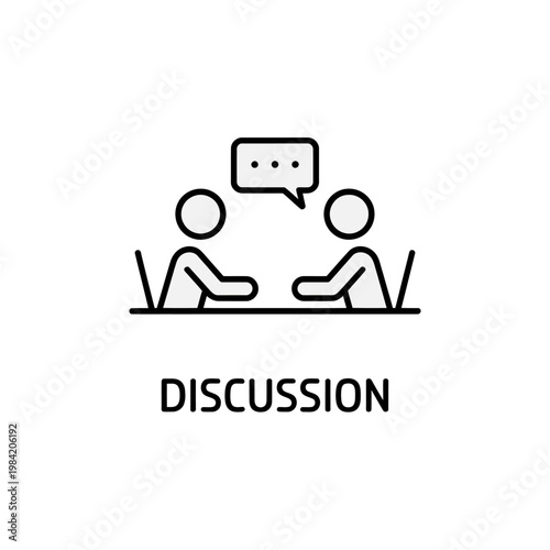 Two people sitting at a table having a discussion