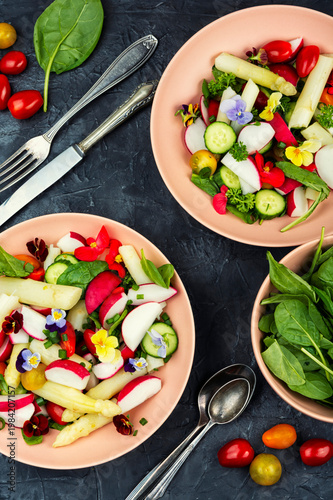 Fresh Spring Salad with White Asparagus, Radish, Cherry Tomatoes and Edible Flowers