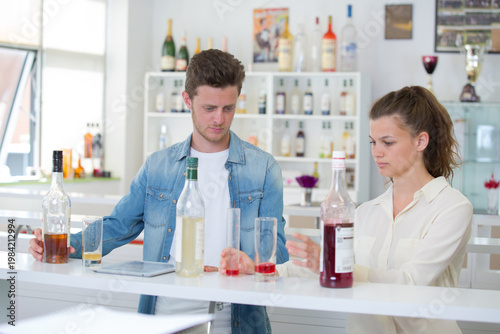 showing how to make cocktial to trainees