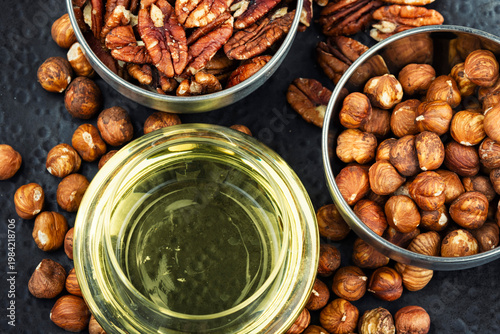 Assorted Nuts with Oil on Plate, Hazelnuts and Pecans Still Life
