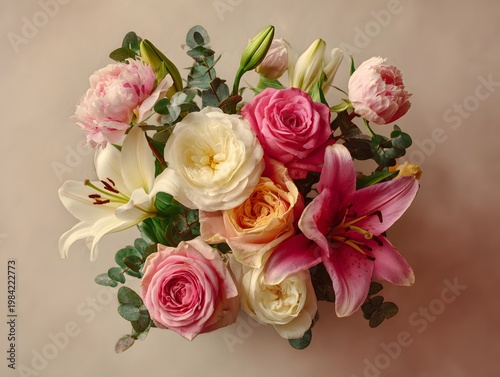 Top View Mixed Flower Bouquet with Roses Peonies and Lilies on Soft Pastel Background Flat Lay Floral Arrangement with Copy Space