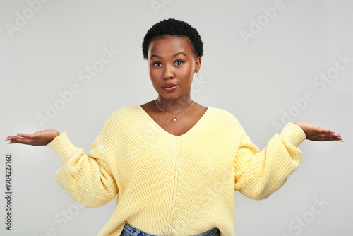 Foto Black woman, portrait and unsure with hands open in studio for question on a white background