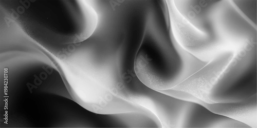 abstract flowing fabric in monochrome, a study in elegant texture. The image focuses on graceful movement and gentle folds, with varying tones that bring out an exquisite play of light and shadow.