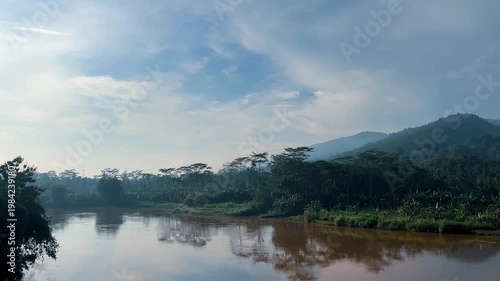 Beautiful Tropical River Flowing Through Lush Green Forest Mountains