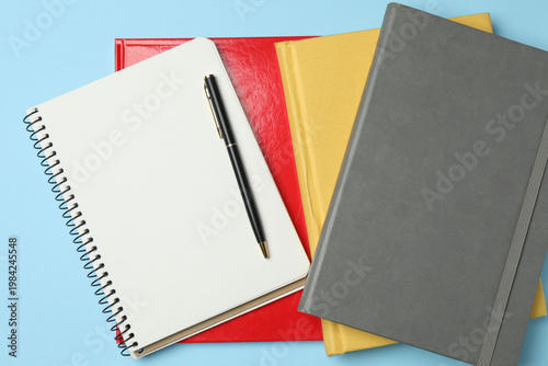 school notebook, pen, spiral notebook on the table. flat lay
