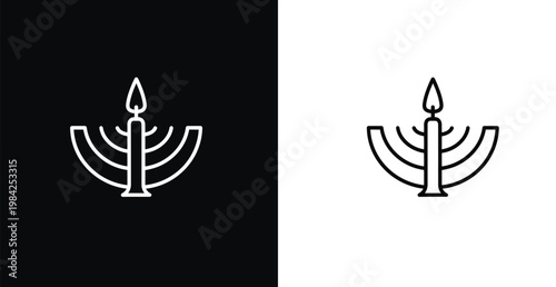 A menorah with a lit candle is depicted in black and white on contrasting backgrounds