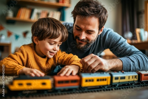 A man and a young boy playing with a toy train