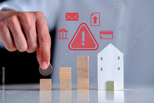bar graph next to a model house, overlaid with digital red warning icons for credit cards, banking, and data alerts. This visual represents financial risk, real estate market instability,