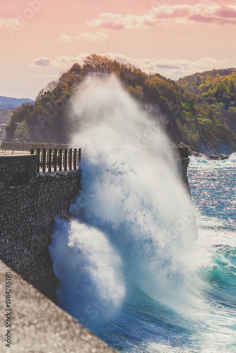 Beautiful seascape in northern Spain. The rocky coast on a sunny day. Beautiful nature, landscape with a stormy sea. The embankment in San Sebastian, Basque Country, Spain, Europe
