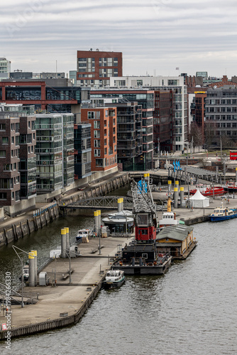 Hamburg HafenCity canal view with modern architecture and working port