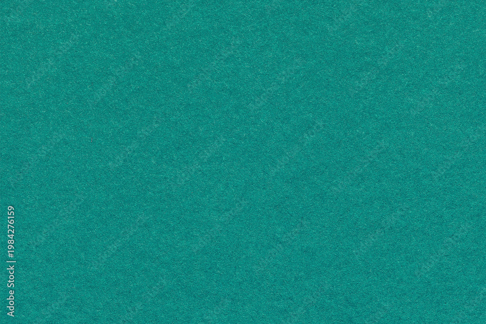 Fototapeta premium Teal textured paper background with subtle grain surface and soft structure. Emerald green backdrop, macro
