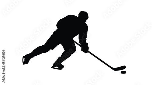 Dynamic silhouette of an ice hockey player skating and hitting the puck