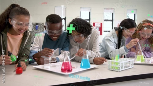 Left student squeezing dropper, group mixing flasks and tubes, observing color change for science