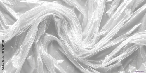A close-up view showcases a crumpled and folded mass of clear plastic, creating a textured and abstract pattern of light and shadow.