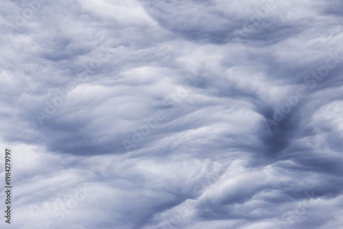 grey layered rain clouds covering the sky before the rain