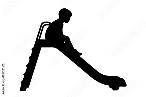 Silhouette on Slide: A child’s silhouette poised on a playground slide, evokes a sense of anticipation and childlike wonder.