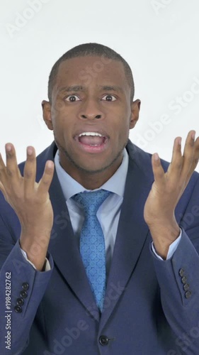 Disappointed African Businessman Reacting Loss on White Background, Vertical Video
