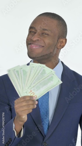 African Businessman Showing Dollar Bills on White Background, Vertical Video