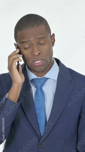 African Businessman Talking on Phone on White Background, Vertical Video