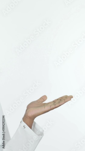 African Doctor Showing on Side on White Background, Vertical Video