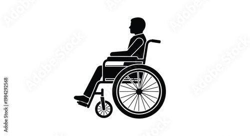 Silhouette of a person in a wheelchair viewed from the side