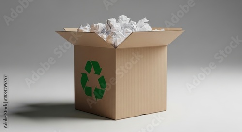 Cardboard box filled with crumpled white paper waste for recycling