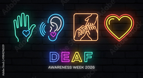 Neon sign with hand, ear, gesture, heart on brick wall. It symbolizes Deaf Awareness week. Multi-colored letters and linear drawing.