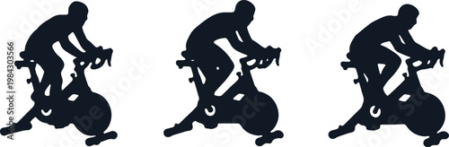 Silhouette of three cyclists riding exercise bikes