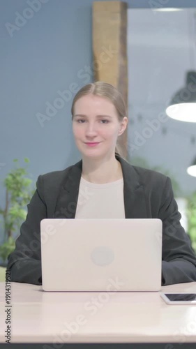 Wallpaper Mural Businesswoman Shaking Head in Rejection while Working on Laptop, Vertical Video Torontodigital.ca