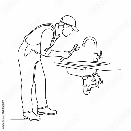 A plumber fixing a kitchen sink, demonstrating expertise. A focused individual working with tools to repair and maintain water systems