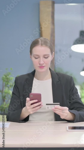 Wallpaper Mural Businesswoman making Successful Online Payment on Smartphone, Vertical Video Torontodigital.ca