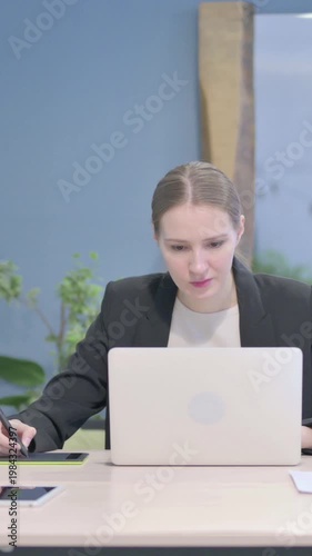 Wallpaper Mural Female Graphic Designer Working on Laptop and Graphic Tablet, Vertical Video Torontodigital.ca