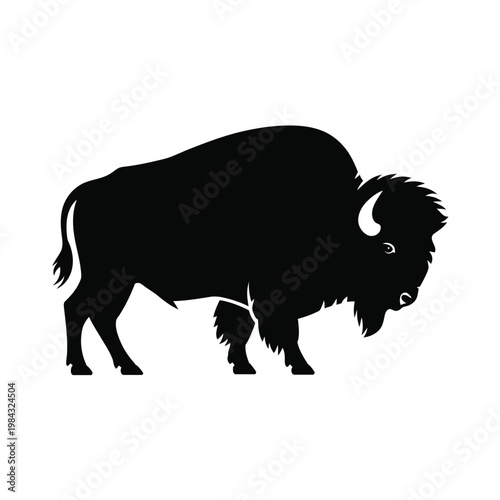 A black silhouette of a bison standing on a plain background