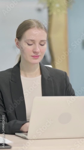 Wallpaper Mural Busy Businesswoman Typing on Laptop in Office, Vertical Video Torontodigital.ca