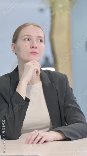 Wallpaper Mural Pensive Businesswoman Thinking while Sitting at Work, Vertical Video Torontodigital.ca