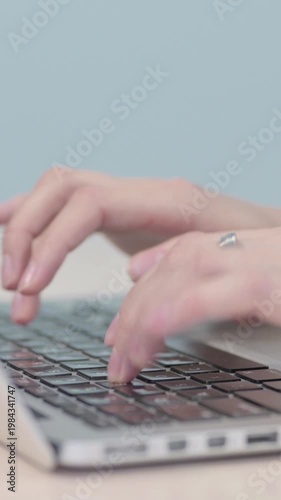 Wallpaper Mural Close up of Hands Typing on Laptop, Vertical Video Torontodigital.ca