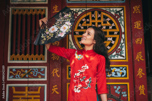 Female traveler in asian dress traveling in temple in southeast asia