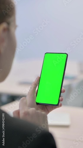 Wallpaper Mural Businesswoman Using Smartphone with Green Screen, Vertical Video Torontodigital.ca