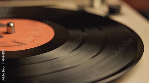 Spinning Vinyl Record On Turntable In Warm Retro Lighting