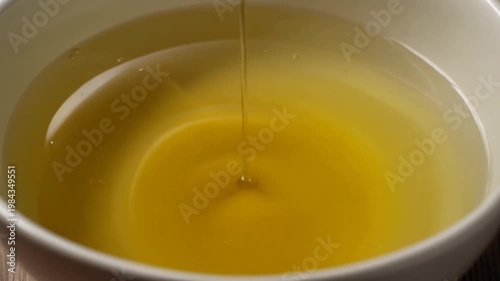 Golden Honey Dripping Smoothly In Close-Up View